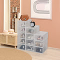 Drop-front shoe boxes stacked in an entryway, clear doors showing the shoes