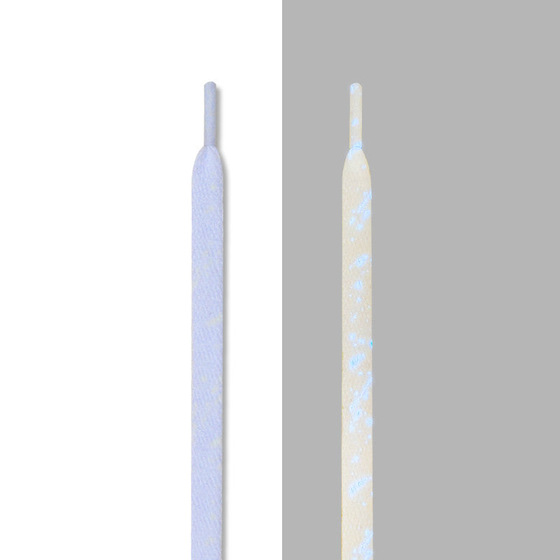 White splatter laces with blue glow, in light and glowing