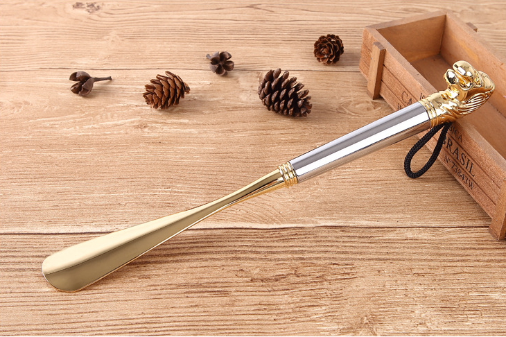 Silver handle Lion Head shoe horn with gold metal blade